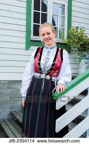 Laerdal Norway young 18 year old woman in traditional Bunard folk Costume at white house stairs dress clothes MR-5. View Large Photo Image Picture - Laerdal Norway young 18 year old woman in traditional Bunard folk Costume at white house stairs dress clothes MR-5.. Fotosearch