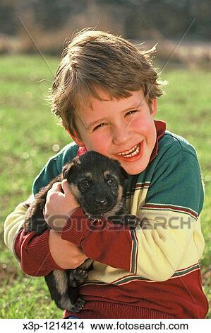 Little boy and puppy View Large Photo Image Picture - Little boy and puppy. Fotosearch