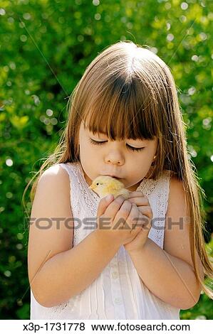 Little girl and chick View Large Photo Image Stock Photo - Little girl and chick. Fotosearch