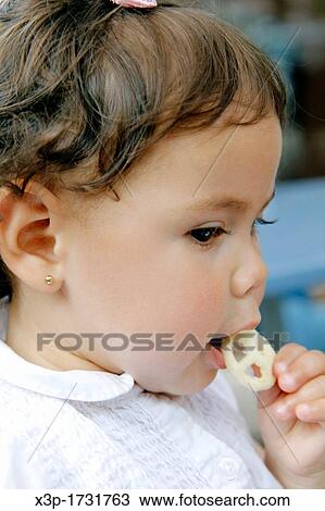 Little girl eating chips View Large Photo Image Stock Image - Little girl eating chips. Fotosearch