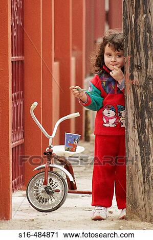 Stock Image - "Little girl eating ice-cream – Bucharest, Romania". Fotosearch