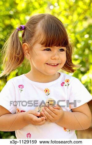 Little girl with chick View Large Photo Image Stock Photo - Little girl with chick. Fotosearch