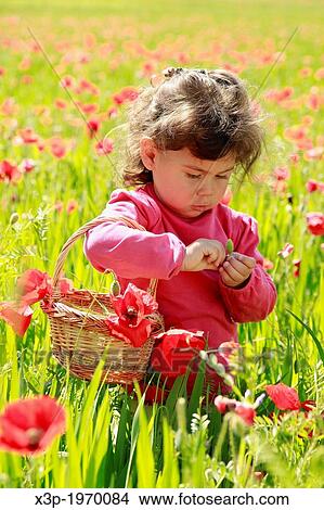 Picture - Little girl with flowers.. Fotosearch