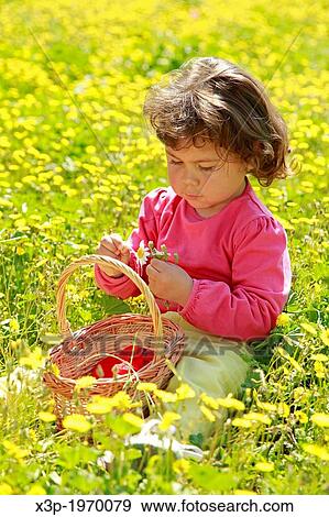 Little girl with flowers. View Large Photo Image Stock Photo - Little girl with flowers.. Fotosearch