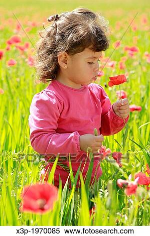 Little girl with flowers. View Large Photo Image Stock Photography - Little girl with flowers.. Fotosearch