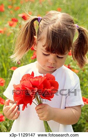 Little girl with poppies View Large Photo Image Stock Photo - Little girl with poppies. Fotosearch