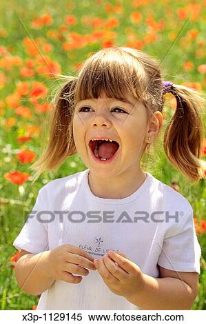 Stock Photography - Little girl with poppies. Fotosearch