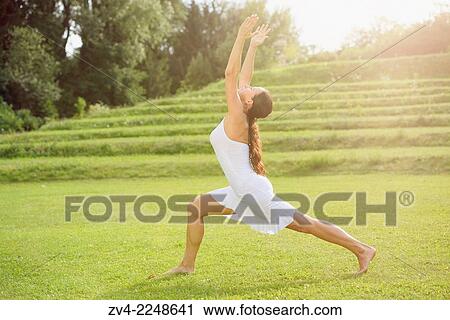 "Middle aged woman doing yoga in a park in summer, Germany. " View Large Photo Image Stock Image - "Middle aged woman doing yoga in a park in summer, Germany. ". Fotosearch