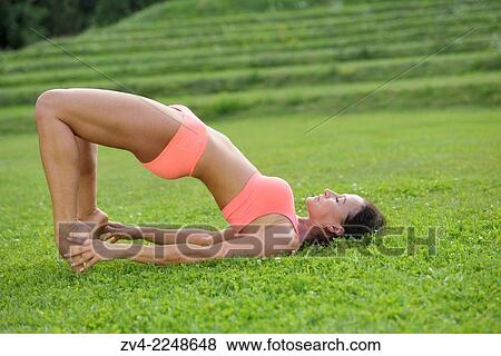 "Middle aged woman doing yoga in a park in summer, Germany. " View Large Photo Image Stock Photo - "Middle aged woman doing yoga in a park in summer, Germany. ". Fotosearch