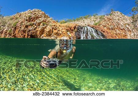 "National Geographic Orion staff CT Ticknor enjoying a swim at Crocodile Creek, Yampi Bay, Kimberley, Western Australia, Australia. " View Large Photo Image Stock Image - "National Geographic Orion staff CT Ticknor enjoying a swim at Crocodile Creek, Yampi Bay, Kimberley, Western Australia, Australia. ". Fotosearch