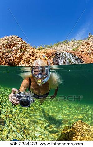 "National Geographic Orion staff CT Ticknor enjoying a swim at Crocodile Creek, Yampi Bay, Kimberley, Western Australia, Australia. " View Large Photo Image Stock Image - "National Geographic Orion staff CT Ticknor enjoying a swim at Crocodile Creek, Yampi Bay, Kimberley, Western Australia, Australia. ". Fotosearch
