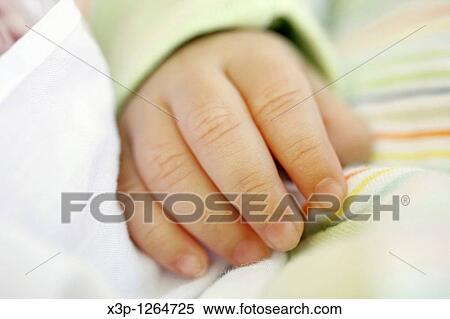Stock Photography - Newborn hand. Fotosearch
