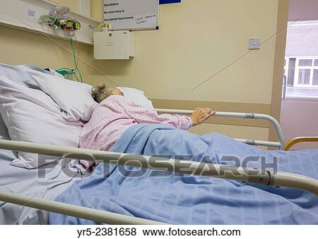 Stock Photo - "Ninety year old lady in National Health Service Hospital in England, United Kingdom. ". Fotosearch