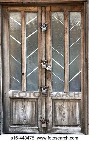 "Old door locked with 4 padlocks - Bucharest, Romania" View Large Photo Image Stock Photography - "Old door locked with 4 padlocks - Bucharest, Romania". Fotosearch