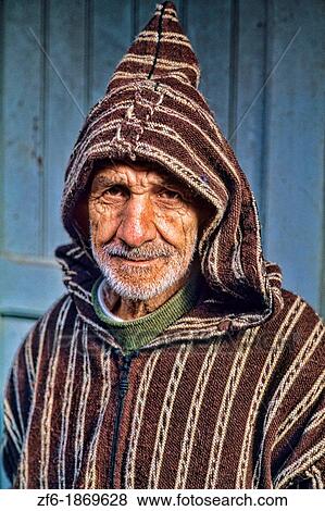 Stock Photo - Old Muslim Man with hood and smiling in Tangier Morocco Africa Portrait. Fotosearch