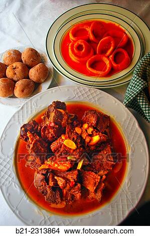 "´Papas arrugadas´ (potatoes cooked in sea water), goat meat in sauce and squids, Tenerife, Canary Islands, Spain" View Large Photo Image Picture - "´Papas arrugadas´ (potatoes cooked in sea water), goat meat in sauce and squids, Tenerife, Canary Islands, Spain". Fotosearch
