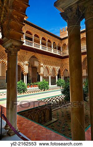 "Patio de las Doncellas (Courtyard of the Maidens) an Italian Renaissance courtyard (1540-72) with Arabesque Mudéjar style plaster work, Alcazar of Seville, Seville, Spain. " View Large Photo Image Stock Image - "Patio de las Doncellas (Courtyard of the Maidens) an Italian Renaissance courtyard (1540-72) with Arabesque Mudéjar style plaster work, Alcazar of Seville, Seville, Spain. ". Fotosearch