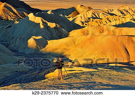 Stock Image - "Photographing at Zabriskie Point. Death Valley National Park, California, USA". Fotosearch
