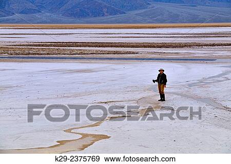 "Photographing in the Cottonball Basin. Death Valley National Park, California, USA" View Large Photo Image Stock Photo - "Photographing in the Cottonball Basin. Death Valley National Park, California, USA". Fotosearch