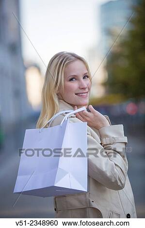 Portrait of a beautiful blonde woman shopping View Large Photo Image Stock Image - Portrait of a beautiful blonde woman shopping. Fotosearch