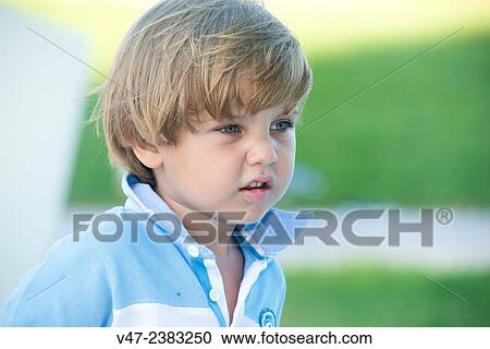 Stock Image - Portrait of a boy in the garden. Fotosearch