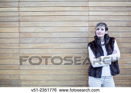 Stock Photograph - Portrait of a stylish woman outdoors looking at camera. Fotosearch