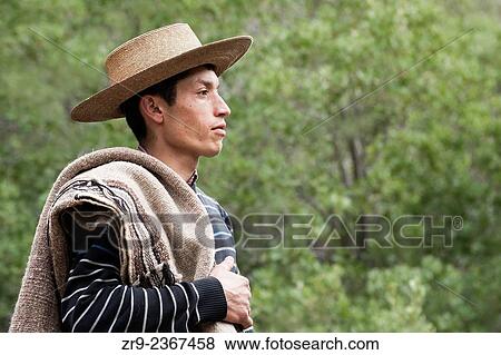 "Portrait of Chilean cowboy in hat, El Toyo region of Cajon del Maipo, Chile, South America. " View Large Photo Image Stock Photo - "Portrait of Chilean cowboy in hat, El Toyo region of Cajon del Maipo, Chile, South America. ". Fotosearch