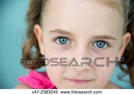 Portrait of little girl with blue eyes View Large Photo Image Stock Photography - Portrait of little girl with blue eyes. Fotosearch