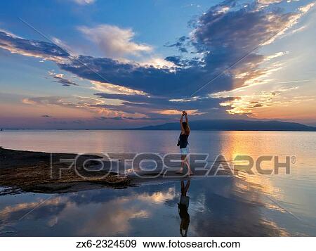 Stock Photo - "Relexed sunset at Trabucador Isthmus. Alfacs Bay. Ebro River Delta Natural Park, Tarragona province, Catalonia, Spain. ". Fotosearch