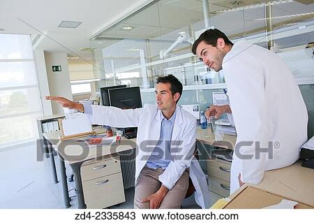 Stock Image - "Researchers in hallway laboratory. Chemical Analysis Laboratory. Technological Services to Industry. Tecnalia Research & Innovation, Donostia, San Sebastian, Gipuzkoa, Basque Country, Spain. ". Fotosearch