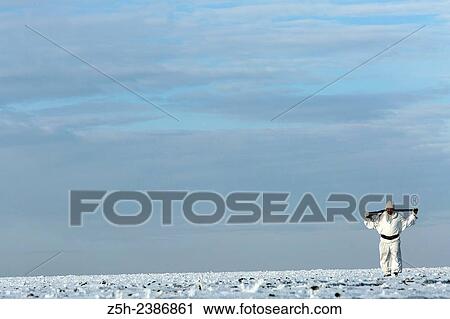 Stock Image - Russian Federation. Voronezh oblvst. Hunter in camouflage white suit on winter hunting.. Fotosearch