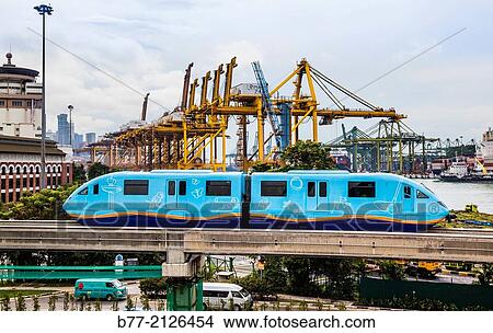"Singapore, monorail link to Sentosa Island against the backdrop of Keppel Container Terminal. " View Large Photo Image Picture - "Singapore, monorail link to Sentosa Island against the backdrop of Keppel Container Terminal. ". Fotosearch