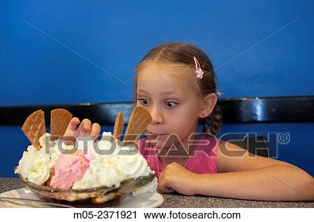 Six year old girl with a Banana split ice cream. View Large Photo Image Stock Image - Six year old girl with a Banana split ice cream.. Fotosearch
