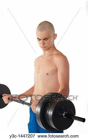 Skinny male teenager working out View Large Photo Image Stock Photo - Skinny male teenager working out. Fotosearch