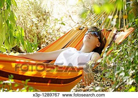 Sleeping in hammock View Large Photo Image Stock Photo - Sleeping in hammock. Fotosearch