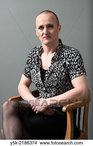 Picture - "Studio Tuinstraat, Tilburg, Netherlands. The 42 year old man, called: ´B´, regularly cross dresses himself as a woman. Wardrobe aswell as make up are done. ". Fotosearch