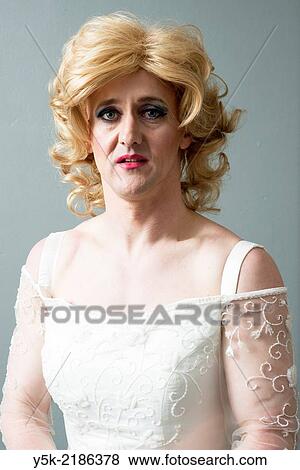 Stock Photo - "Studio Tuinstraat, Tilburg, Netherlands. The 42 year old man, called: ´B´, regularly cross dresses himself as a woman. Wardrobe aswell as make up are done. ". Fotosearch