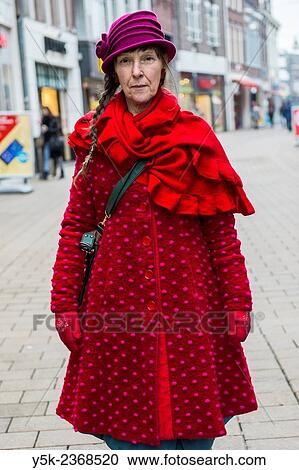 "Tilburg, Netherlands. Street portrait of a 61 year old colorful dressed and fashionable woman. " View Large Photo Image Stock Image - "Tilburg, Netherlands. Street portrait of a 61 year old colorful dressed and fashionable woman. ". Fotosearch