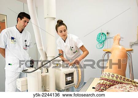 "Tilburg, Netherlands. Two radio therapists working together to produce a post operative X-Ray of a patient, who just received a new hip in surgery. " View Large Photo Image Stock Photograph - "Tilburg, Netherlands. Two radio therapists working together to produce a post operative X-Ray of a patient, who just received a new hip in surgery. ". Fotosearch