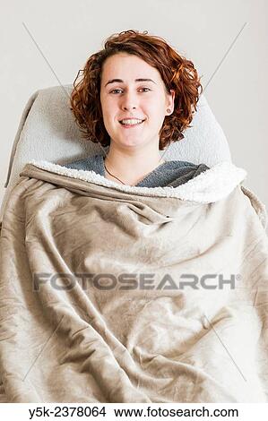 "Tilburg, Netherlands. Young, attractive woman getting ready for a beauty treatment in a beauty salon. " View Large Photo Image Picture - "Tilburg, Netherlands. Young, attractive woman getting ready for a beauty treatment in a beauty salon. ". Fotosearch