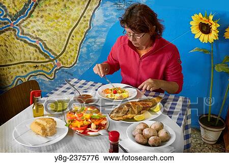 "Tourist eating local food at Casa Africa Restaurant, Taganana, Tenerife, Canary Islands, Spain. " View Large Photo Image Stock Photograph - "Tourist eating local food at Casa Africa Restaurant, Taganana, Tenerife, Canary Islands, Spain. ". Fotosearch