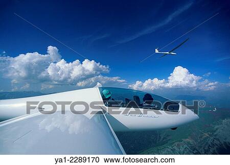 "Two glider planes Duo Discus flying over Pyrenees mountains, north of Jaca, Aragon, Spain. " View Large Photo Image Stock Image - "Two glider planes Duo Discus flying over Pyrenees mountains, north of Jaca, Aragon, Spain. ". Fotosearch