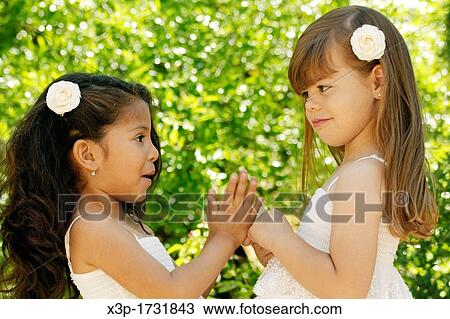 Two little girls View Large Photo Image Stock Image - Two little girls. Fotosearch