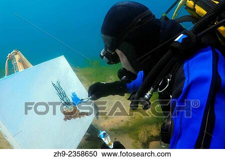 Stock Image - "Underwater artist Yuriy Alexeev (Yuri Alekseev) paints a picture under water. Lake Baikal, Listvyanka, Irkutsky District, Irkutsk Oblast, Siberia, Russia, Eurasia. ". Fotosearch