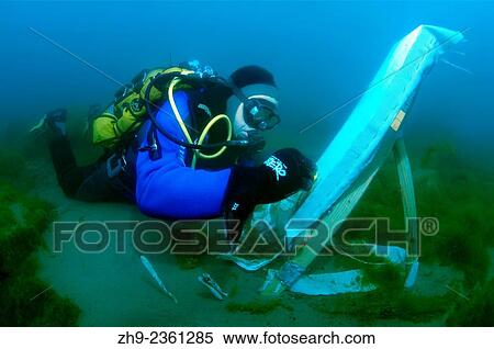 Stock Photography - "Underwater artist Yuriy Alexeev (Yuri Alekseev) paints a picture under water. Lake Baikal, Listvyanka, Irkutsky District, Irkutsk Oblast, Siberia, Russia, Eurasia. ". Fotosearch