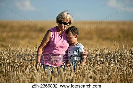 Wheat fields of the Belgorod region. Grandmother with grandson in a wheat field. View Large Photo Image Stock Image - Wheat fields of the Belgorod region. Grandmother with grandson in a wheat field.. Fotosearch