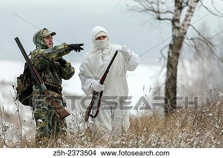 Winter hunting in a camouflage suit. Belgorod region. View Large Photo Image Picture - Winter hunting in a camouflage suit. Belgorod region.. Fotosearch