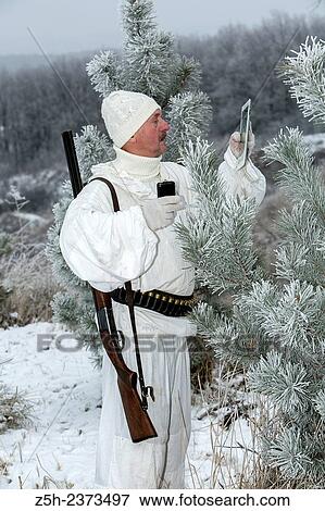 Winter hunting in white camouflage suit. Belgorod region. View Large Photo Image Stock Photo - Winter hunting in white camouflage suit. Belgorod region.. Fotosearch