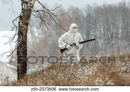 Winter hunting in white camouflage suit. Belgorod region. View Large Photo Image Stock Photograph - Winter hunting in white camouflage suit. Belgorod region.. Fotosearch
