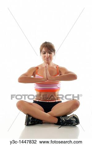 Woman exercising yoga View Large Photo Image Stock Image - Woman exercising yoga. Fotosearch